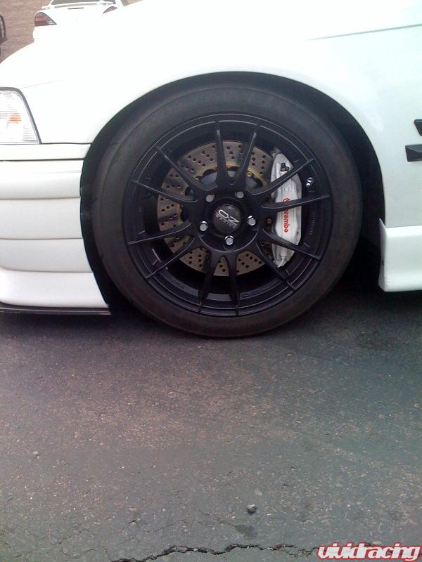 White car gold wheels Id say the brakes would look nice in black