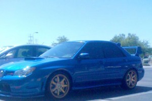 Agency Power Gold Wheels on a STI