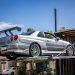 Silver Nissan R32 with body kit.