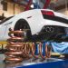 Gold performance suspension springs with white Lamborghini Gallardo.