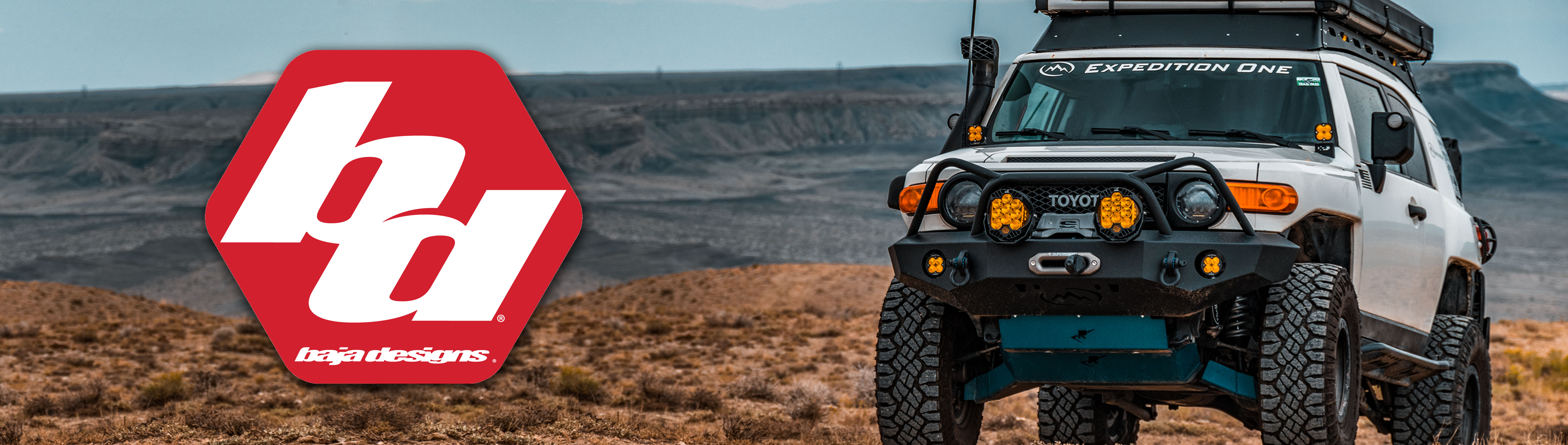 White Toyota FJ Cruiser with Baja Designs lights in desert